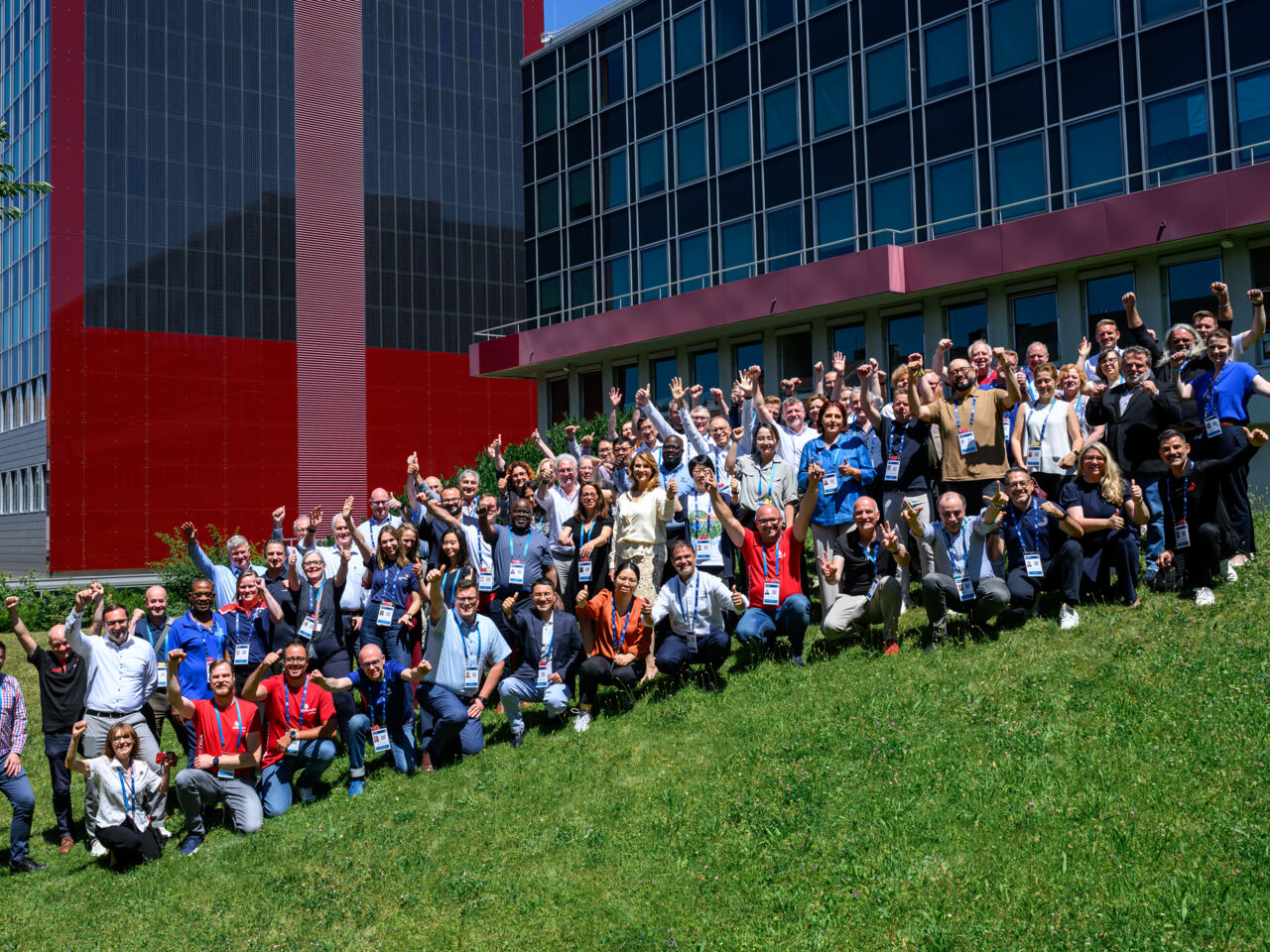Participants pose on a grassy slope for a group photograph at the first face-to-face workshop held on 1-3 July in Vienna, Austria.&nbsp;
