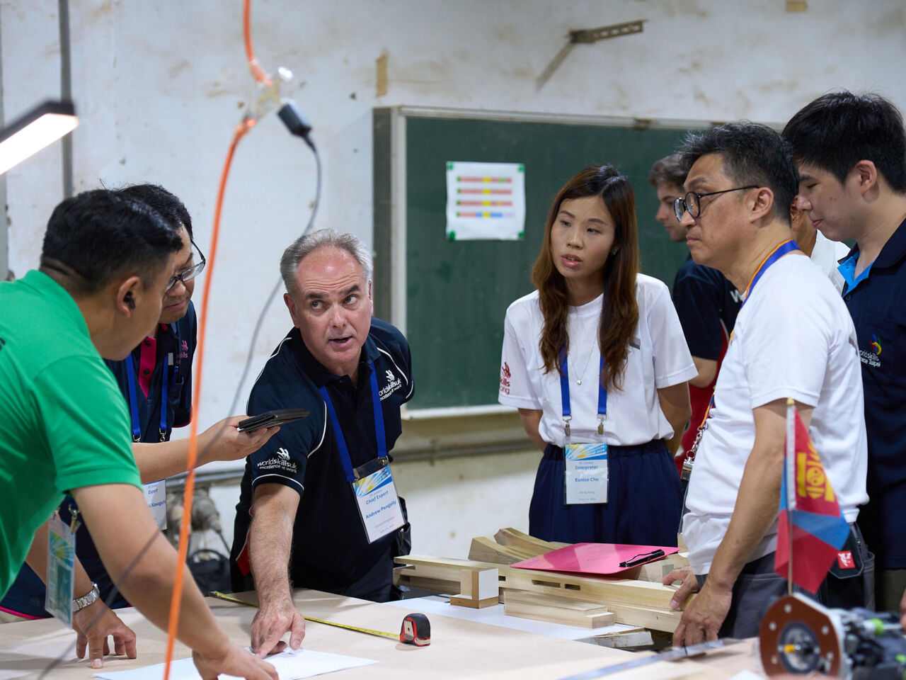 A group stand discussing WorldSkills training at a Skills Cooperation Workshop hosted by WorldSkills Chinese Taipei in June and July 2024.
